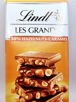 молочный шоколад Lindt LES GRANDES Milk Hazelnut & Caramel 38% с лесным орехом и карамелью, 150 г (Из Финляндии)