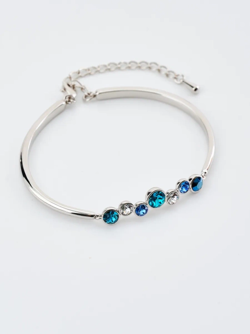 Жесткий браслет Эльза с синими камнями Swarovski