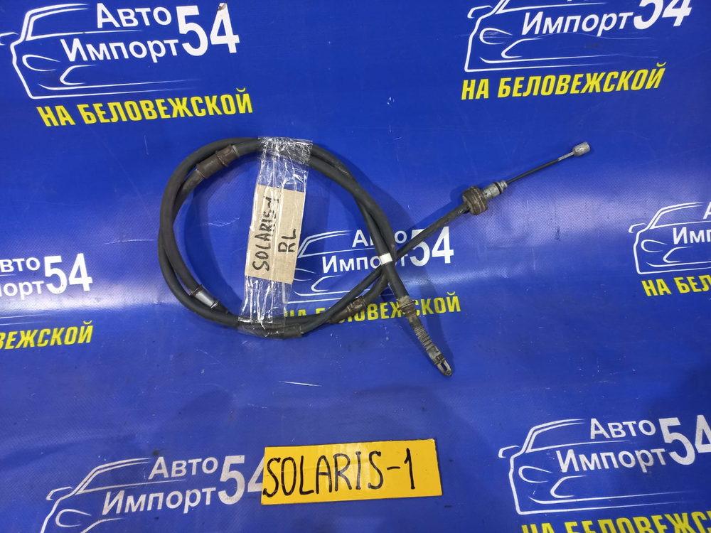 Трос ручника левый HYUNDAI SOLARIS 2014