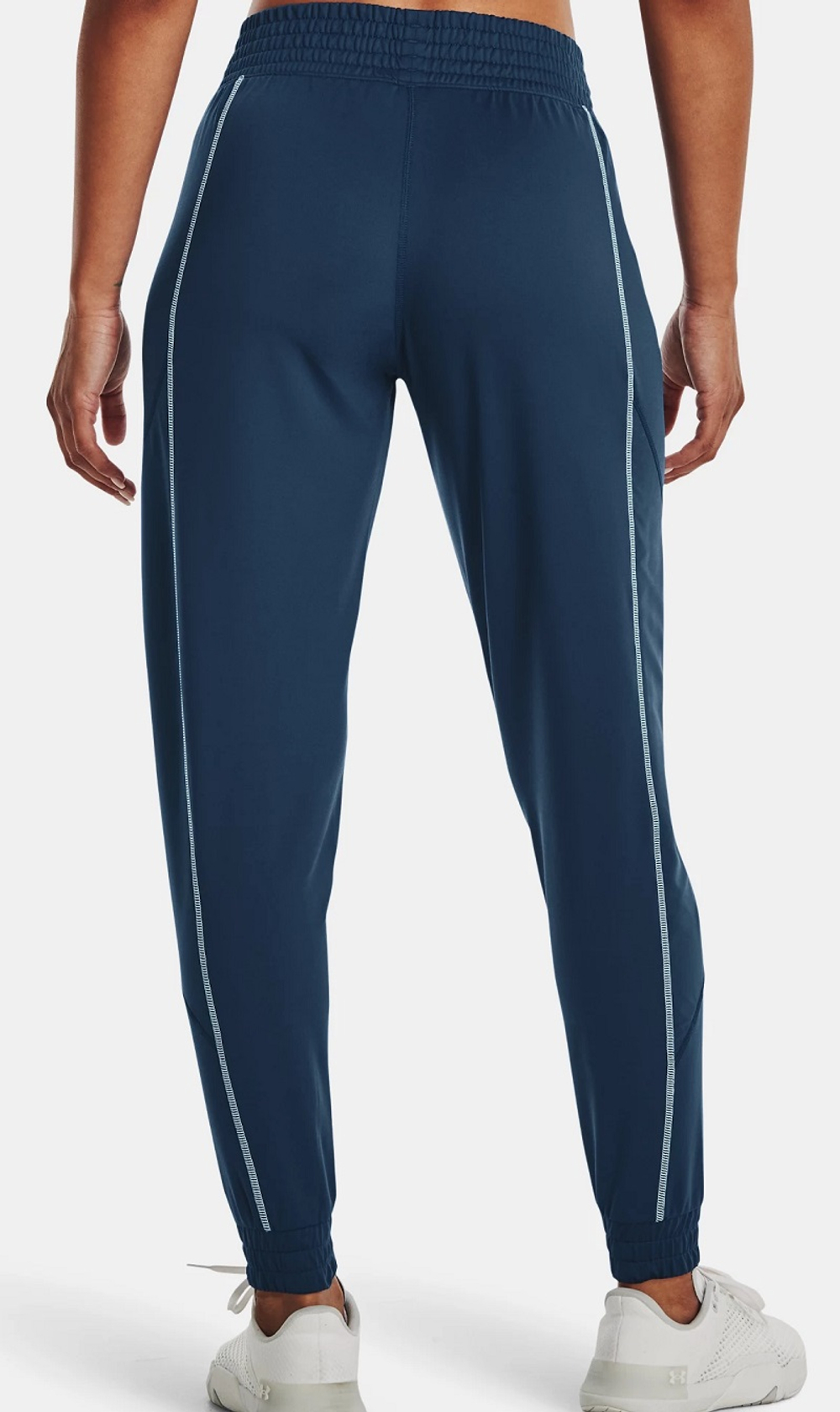 Женские теннисные брюки Under Armour Women's UA Train Cold Weather Pants - petrol blue/fuse teal