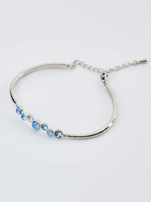 Жесткий браслет Эльза с голубыми камнями Swarovski