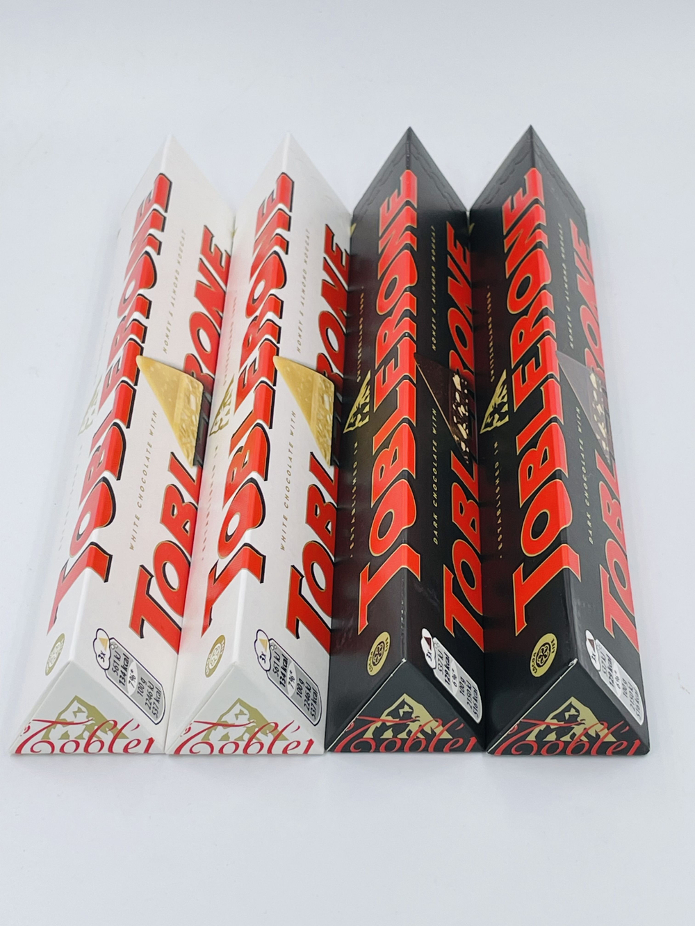 Toblerone темный шоколад с медом и нугой (2 шт. по 100 г) + белый шоколад с медом и нугой (2 шт. по 100 г) (Швейцария), 400 г