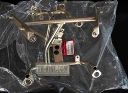 50310-KWN-930 (50310-KWN-640). STAY, FR. COVER. Headlight Stay. Honda PCX125 1 gen.