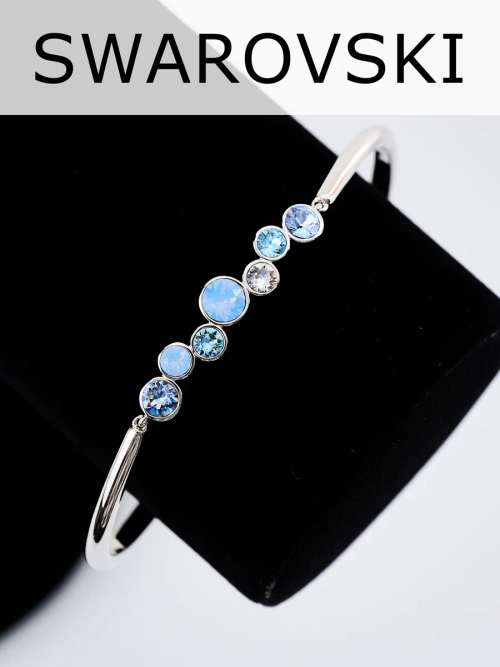 Жесткий браслет Эльза с голубыми камнями Swarovski