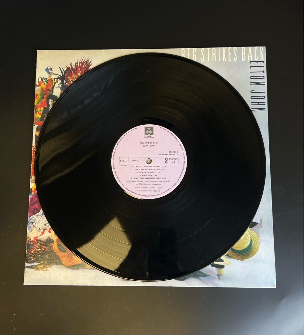 LP Elton John – Reg Strikes Back. Виниловая пластинка 12 дюймов. Югославия 1988 год.