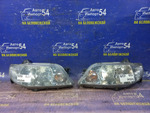 Фара передняя левая MAZDA FAMILIA 2000-2003