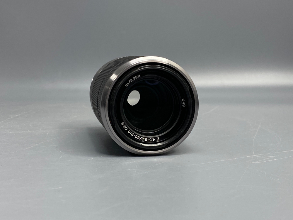 Sony 55-210mm f/4.5-6.3 E OSS микроточки внутри линзы