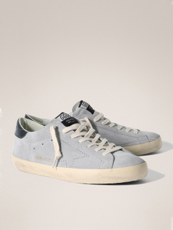 Men's Super Strar in light blue suede with a blue insert on the heel and a perforated star