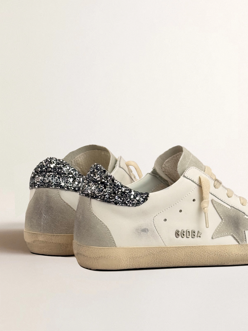 Super Star in white leather with grey suede star and silver glitter heel tab