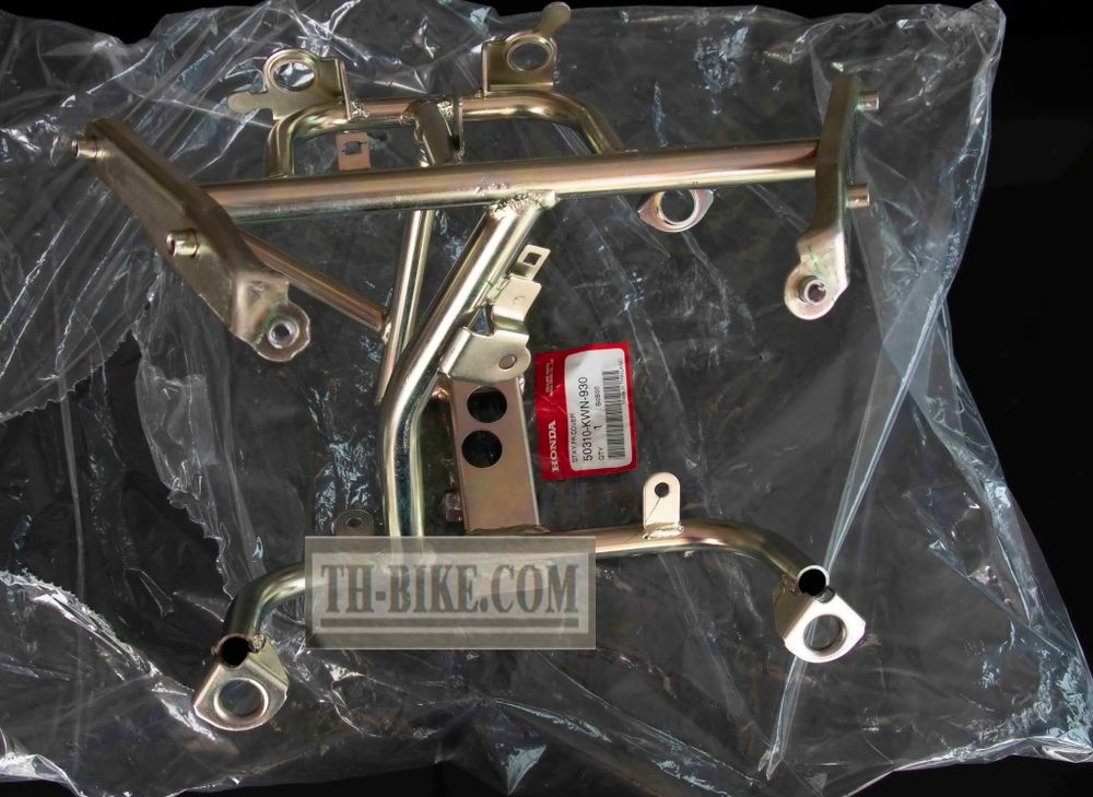 50310-KWN-930 (50310-KWN-640). STAY, FR. COVER. Headlight Stay. Honda PCX125 1 gen.