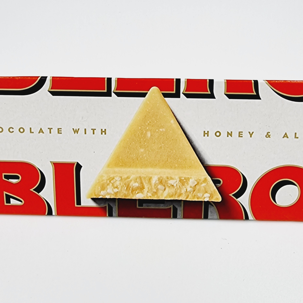 Toblerone Шоколад белый с миндальной нугой и мягким медовым вкусом 100 г (Из Финляндии)