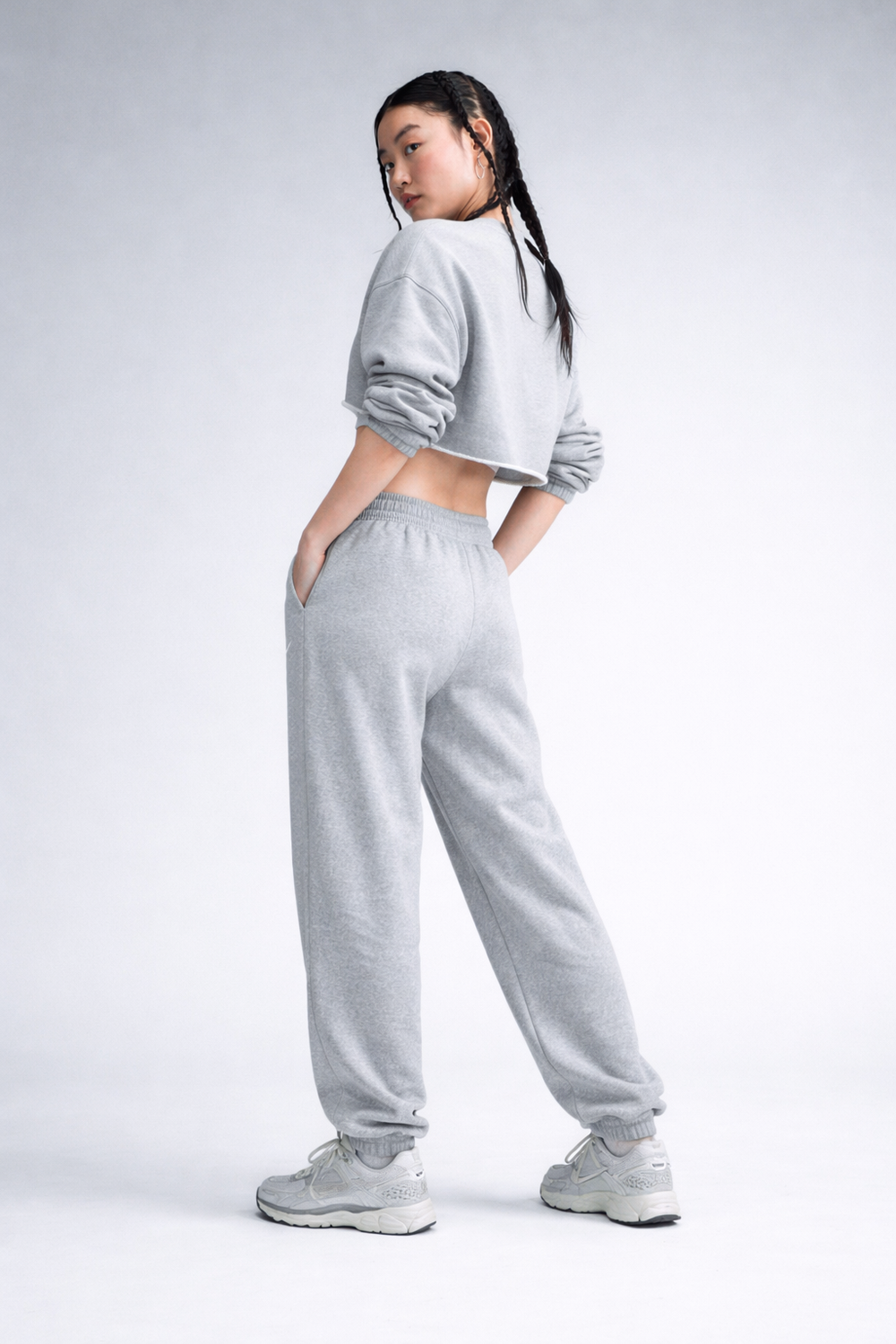 Женские теннисные брюки Nike Sportswear Phoenix Fleece - dark grey heather/sail
