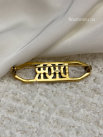 Брошь Ди. золотистая со стразами