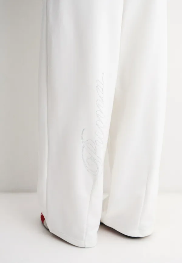 Брюки спортивные женские PUMA ESS GRAPHIC LEO LUXE Bedazzled Slouchy Pants TR