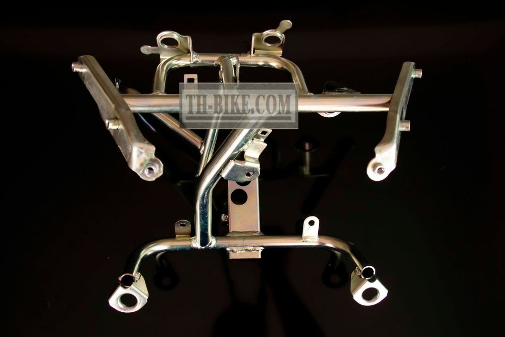 50310-KWN-930 (50310-KWN-640). STAY, FR. COVER. Headlight Stay. Honda PCX125 1 gen.