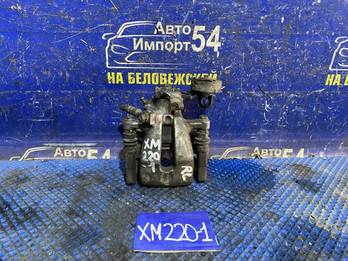 Суппорт тормозной задний левый SUBARU TRAVIQ 2003