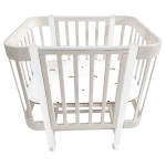 Кровать детская Indigo Italiano Baby продольный маятник на колесах кашемир-белый