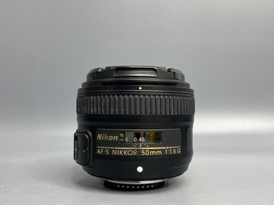 Nikon 50mm 1.8G пылинки