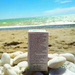 100% натуральное масло эфирное из древесины розового дерева на фоне крымской природы