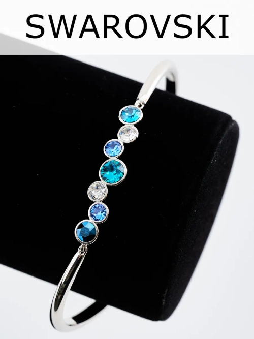 Жесткий браслет Эльза с синими камнями Swarovski