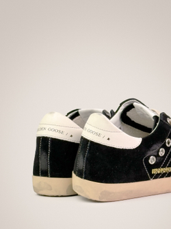 Super Star in black suede with white leather star and heel tab