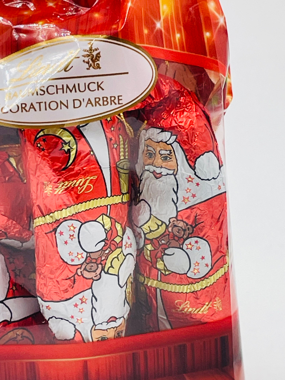 Lindt Набор шоколадных ёлочных украшений мини Деды морозы, 120 г, в 1 уп. 12 фигурок (Германия)