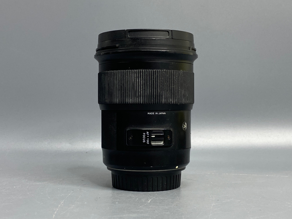 Sigma AF 50mm 1.4 DG HSM Art Canon EF царапки на линзе
