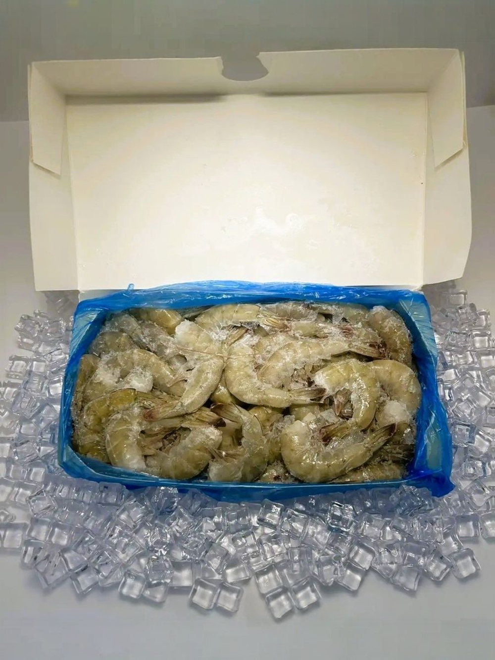 Креветка Королевская коробочка 1.8кг сыро-мороженая без головы 21/25