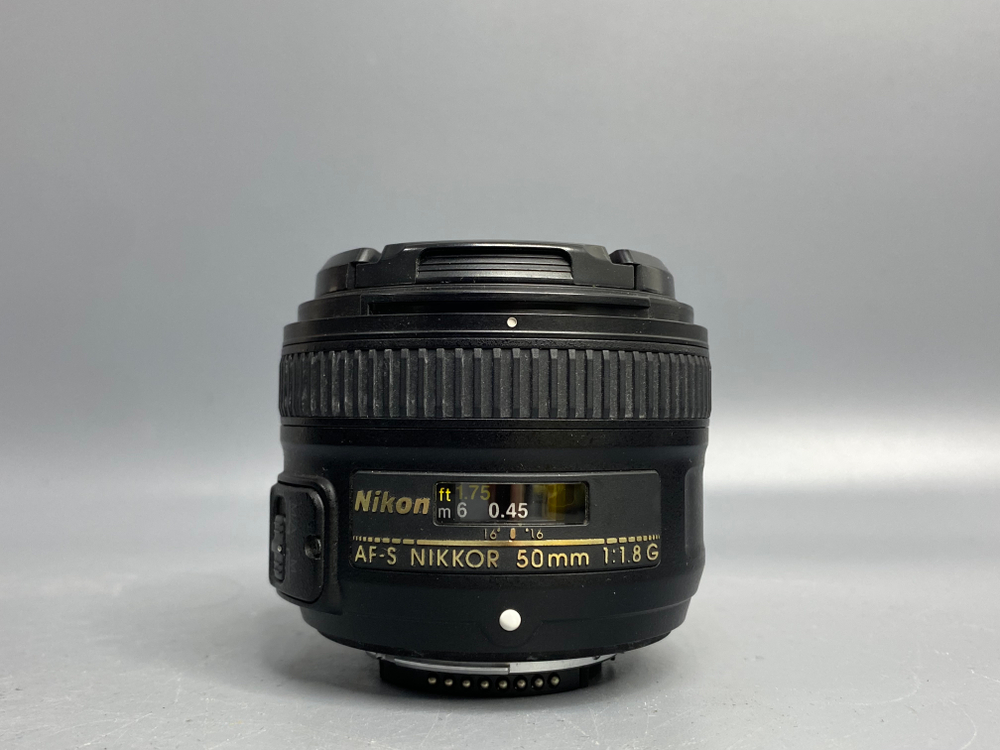 Nikon 50mm 1.8G пылинки