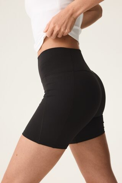 Короткие спортивные легинсы с карманом SoftMove™ - H&M