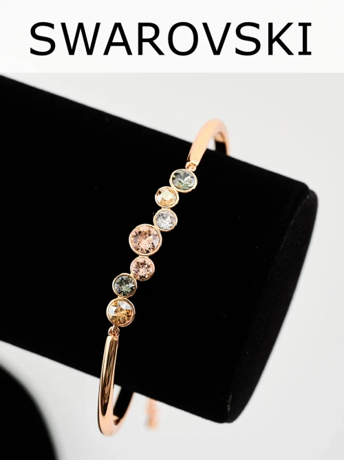 Жесткий браслет Эльза с камнями Swarovski шампань
