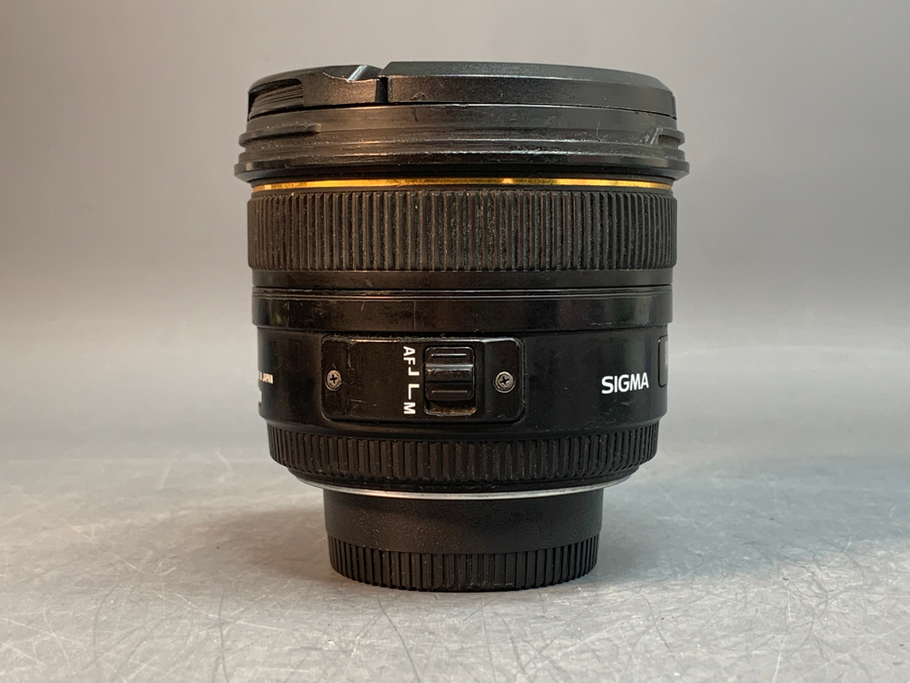 Sigma AF 50mm 1.4 EX DG HSM Nikon F, царапины на линзах