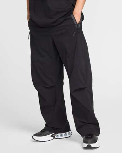 HM7158-010 Брюки M NK TCH WVN PANT OS