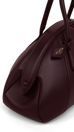 ALAÏA СУМКА С ВЕРХНЕЙ РУЧКОЙ ИЗ ТЕЛЯЧЬЕЙ КОЖИ, БОРДОВЫЙ