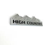 Накладки/наклейки High Country объемные ("Горная страна" 12,5х3,5см). Серебристый с черной надписью